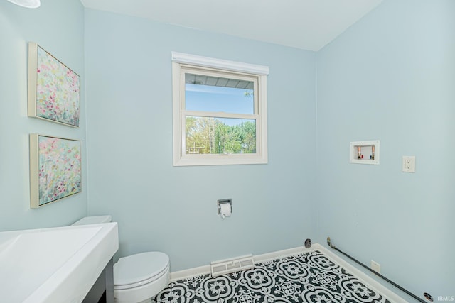 5002 Buffalo Ct, Fort Wayne, IN 46804 - half bath with baseboards, toilet, and vanity