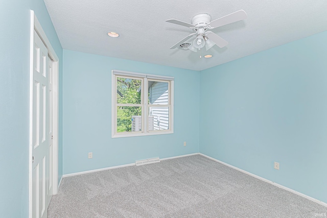 5002 Buffalo Ct, Fort Wayne, IN 46804 - unfurnished bedroom featuring carpet floors, baseboards, a closet, a textured ceiling, and a ceiling fan