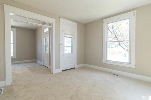 spare room with carpet flooring and baseboards