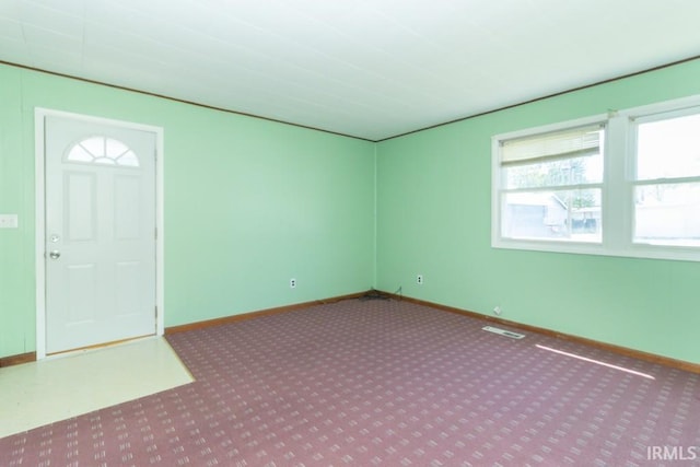 spare room with carpet floors and baseboards