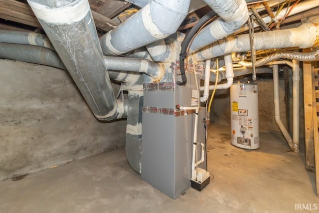 utility room featuring water heater and heating unit