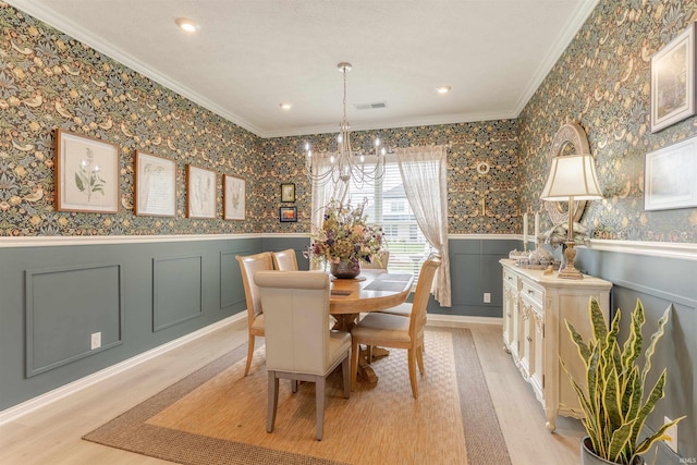 5512 Abbe Wood Dr, Newburgh, IN 47630 - dining space featuring a chandelier, light wood-style floors, ornamental molding, a wainscoted wall, and recessed lighting