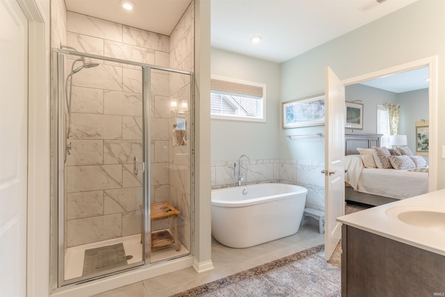 5512 Abbe Wood Dr, Newburgh, IN 47630 - bathroom with a stall shower, a soaking tub, connected bathroom, tile patterned floors, and vanity