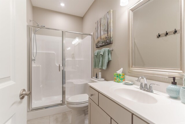 5512 Abbe Wood Dr, Newburgh, IN 47630 - full bath featuring a stall shower, toilet, vanity, tile patterned flooring, and recessed lighting