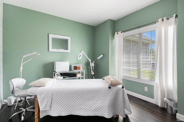19781 Hidden Meadow Trl, Goshen, IN 46528 - bedroom featuring baseboards and dark wood-style floors