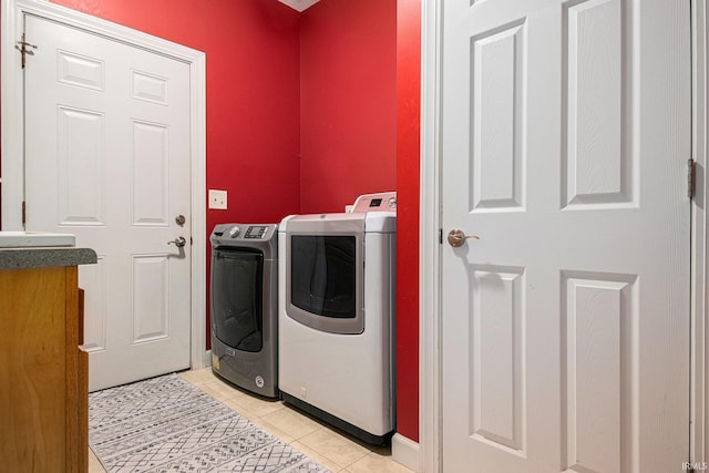 19781 Hidden Meadow Trl, Goshen, IN 46528 - clothes washing area with separate washer and dryer, light tile patterned floors, and baseboards
