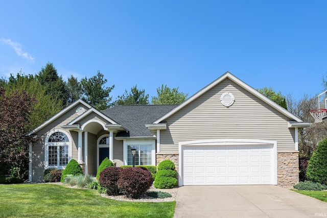 19781 Hidden Meadow Trl, Goshen, IN 46528 - ranch-style home with concrete driveway, an attached garage, a front lawn, and stone siding