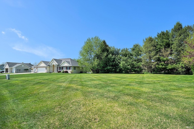 19781 Hidden Meadow Trl, Goshen, IN 46528 - view of grassy yard featuring a garage