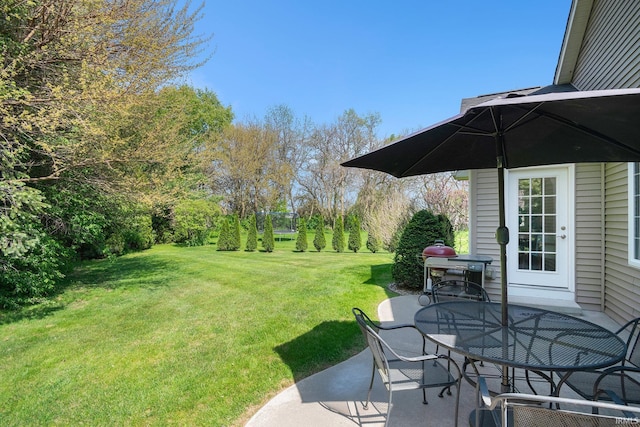 19781 Hidden Meadow Trl, Goshen, IN 46528 - view of grassy yard featuring outdoor dining area and a patio area