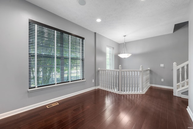 2378 The Springs Dr, Indianapolis, IN 46260 - unfurnished dining area featuring baseboards, a textured ceiling, wood finished floors, and recessed lighting