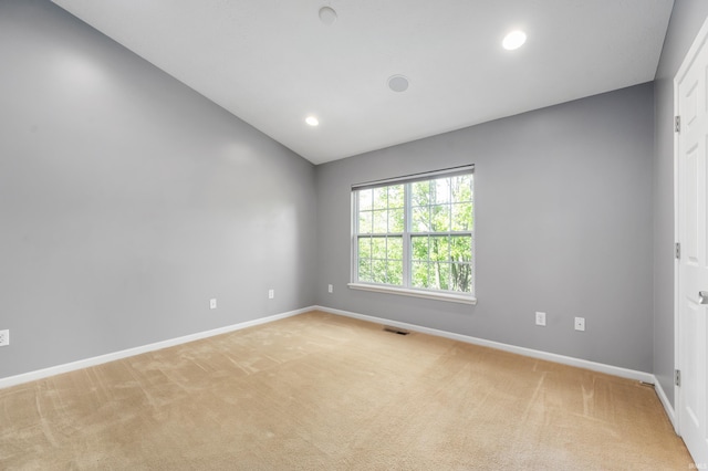 2378 The Springs Dr, Indianapolis, IN 46260 - spare room with light carpet, baseboards, lofted ceiling, and recessed lighting