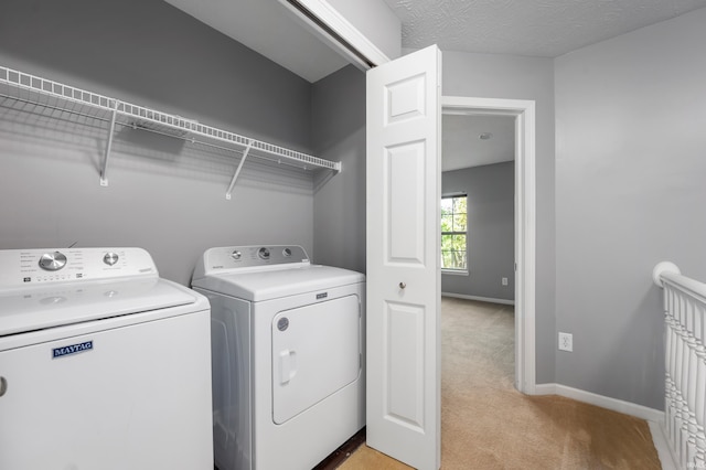 2378 The Springs Dr, Indianapolis, IN 46260 - laundry area featuring separate washer and dryer, light colored carpet, and baseboards