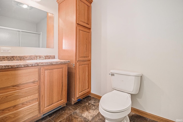 26183 Northland Crossing Dr, Elkhart, IN 46514 - full bathroom featuring baseboards, toilet, a shower stall, and vanity