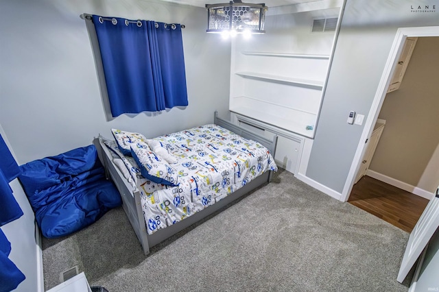 bedroom with carpet flooring and baseboards