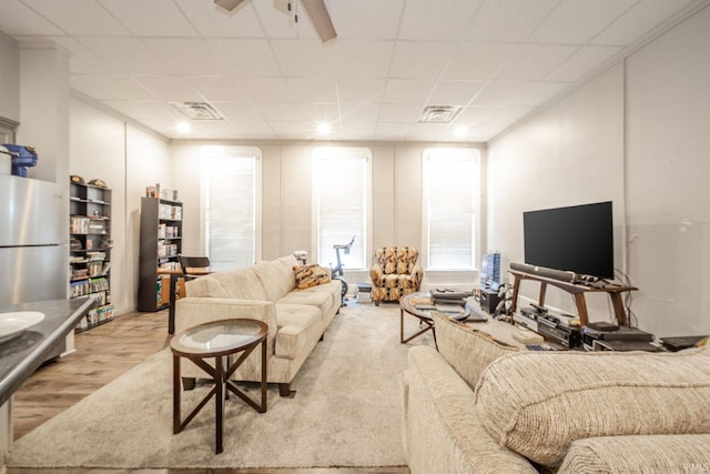 28 N Washington St, Knightstown, IN 47362 - living area with wood finished floors and a paneled ceiling