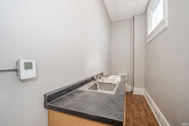 28 N Washington St, Knightstown, IN 47362 - washroom featuring a sink, dark wood-style floors, and baseboards
