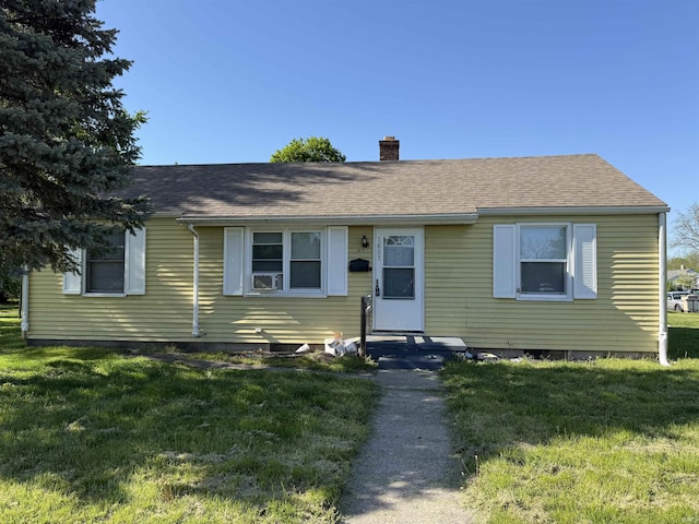 1803 W Dubail St, South Bend, IN 46613 - view of front facade with a chimney, a front lawn, and a shingled roof