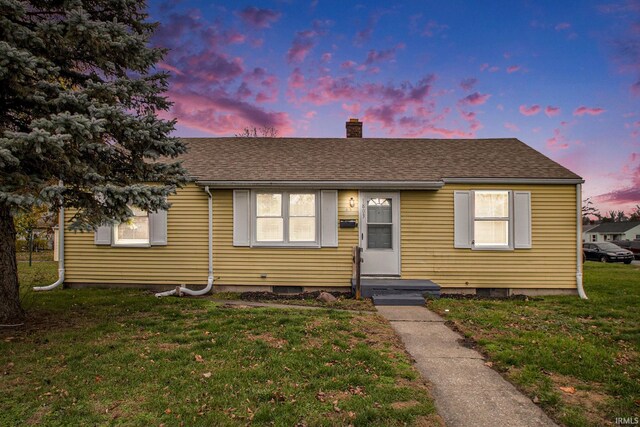 1803 W Dubail St, South Bend, IN 46613 - bungalow-style house featuring a chimney, a front lawn, and a shingled roof