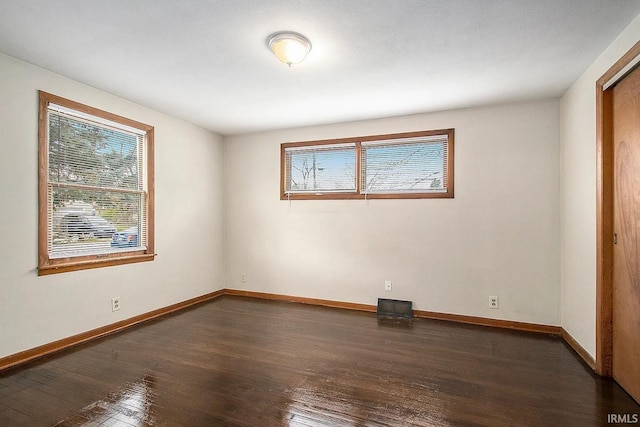 1803 W Dubail St, South Bend, IN 46613 - empty room featuring healthy amount of natural light, wood-type flooring, and baseboards