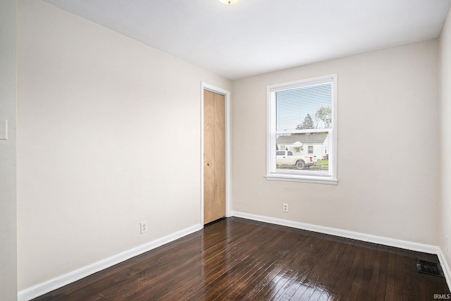1803 W Dubail St, South Bend, IN 46613 - spare room featuring baseboards and dark wood-style flooring