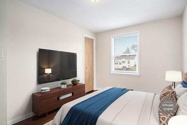 1803 W Dubail St, South Bend, IN 46613 - bedroom with dark wood-type flooring and baseboards