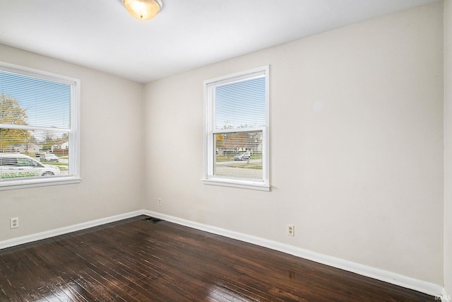 1803 W Dubail St, South Bend, IN 46613 - spare room featuring dark wood finished floors and baseboards