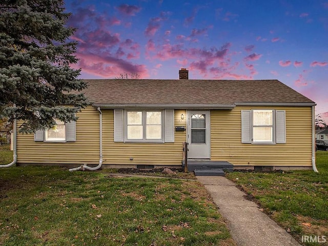 1803 W Dubail St, South Bend, IN 46613 - bungalow with a chimney and a front lawn