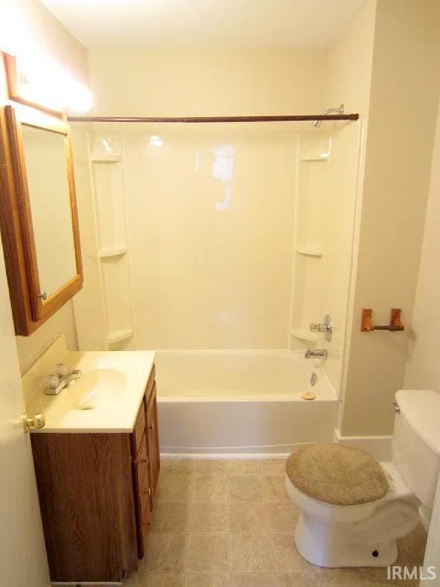 full bathroom featuring toilet, vanity, and  shower combination