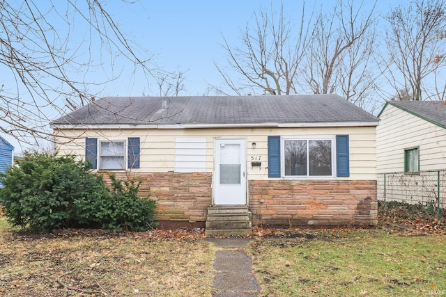 517 S Chicago St, South Bend, IN 46619 - view of front of property featuring entry steps, stone siding, and a shingled roof