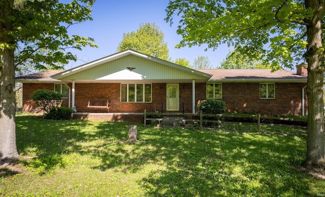 2105 N 100 W, Winchester, IN 47394 - single story home with brick siding, a chimney, and a front yard