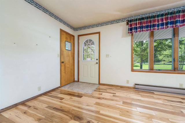 2105 N 100 W, Winchester, IN 47394 - foyer entrance with wood finished floors, baseboards, and baseboard heating