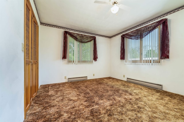 2105 N 100 W, Winchester, IN 47394 - unfurnished bedroom featuring a baseboard heating unit, carpet floors, a closet, and a ceiling fan