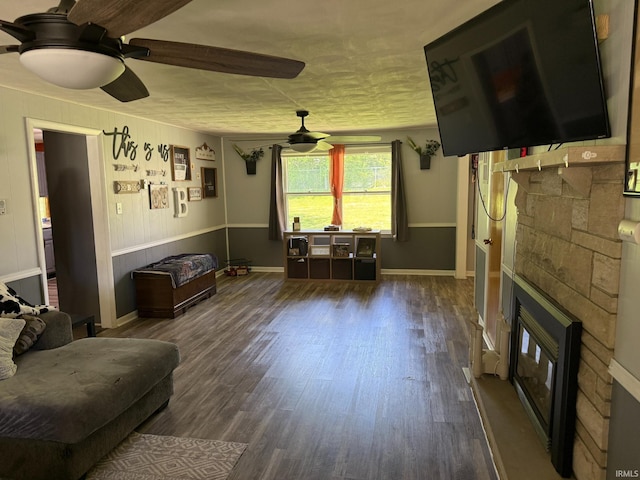 310 Edgeway Dr, Alexandria, IN 46001 - living room with a stone fireplace, a ceiling fan, wood finished floors, and baseboards