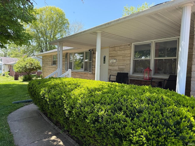 310 Edgeway Dr, Alexandria, IN 46001 - entrance to property with a lawn, stone siding, and a porch