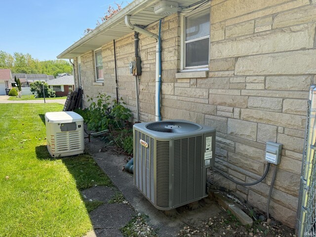 310 Edgeway Dr, Alexandria, IN 46001 - exterior view of cooling unit, a power unit, stone siding, and electric meter