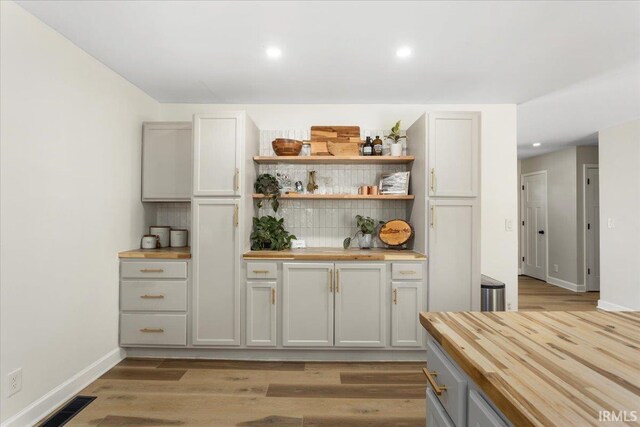 736 Paradise Ave, Lafayette, IN 47905 - bar featuring backsplash, light wood-style flooring, baseboards, and recessed lighting