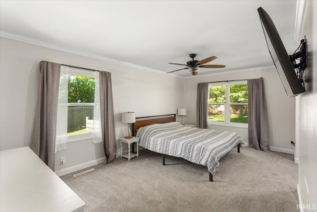736 Paradise Ave, Lafayette, IN 47905 - bedroom featuring multiple windows, baseboards, crown molding, and light carpet