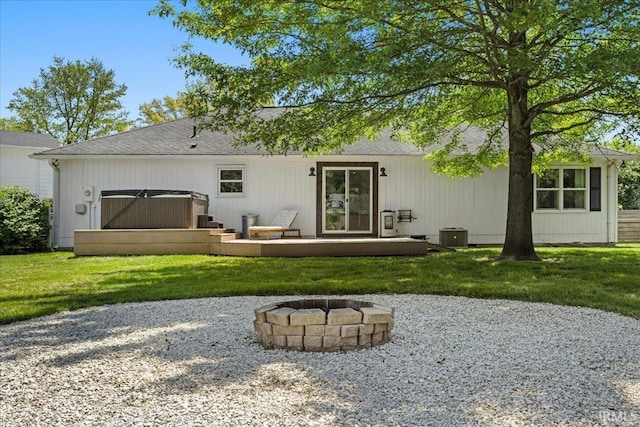736 Paradise Ave, Lafayette, IN 47905 - rear view of property with a fire pit, a hot tub, roof with shingles, and a yard