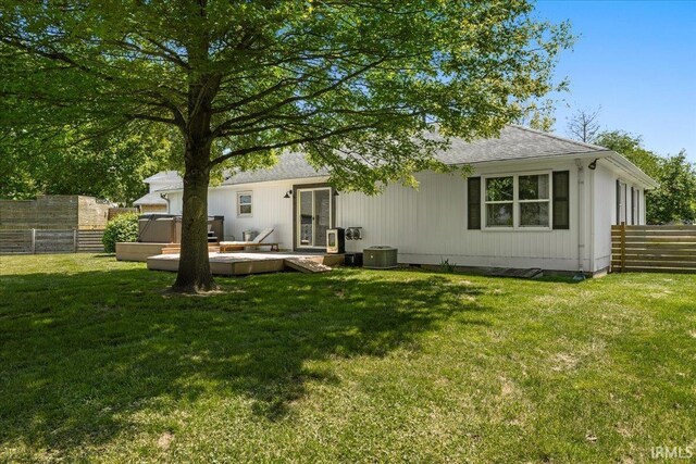 736 Paradise Ave, Lafayette, IN 47905 - back of property featuring a hot tub, central air condition unit, roof with shingles, and a deck
