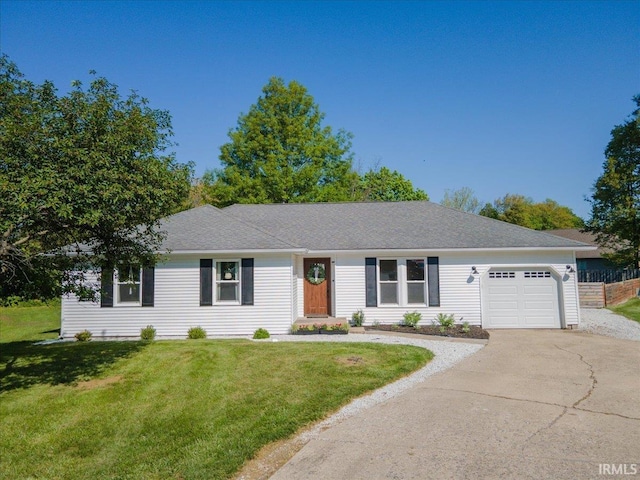 736 Paradise Ave, Lafayette, IN 47905 - ranch-style house with concrete driveway, an attached garage, and a front lawn