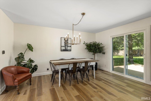 736 Paradise Ave, Lafayette, IN 47905 - dining space featuring light wood-style floors, a chandelier, and baseboards