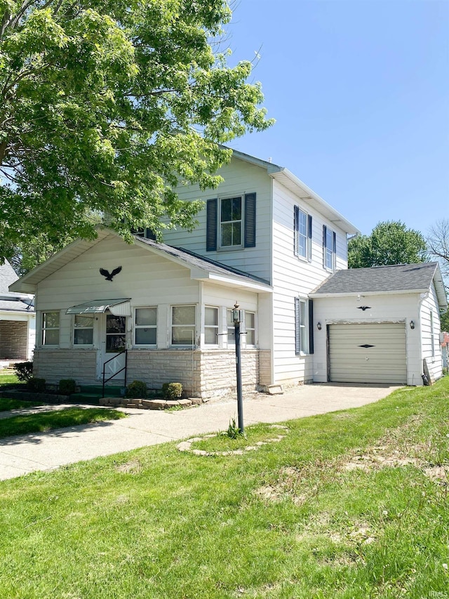 710 N Union St, Union City, IN 47390 - view of front facade with an attached garage, a front lawn, stone siding, and driveway