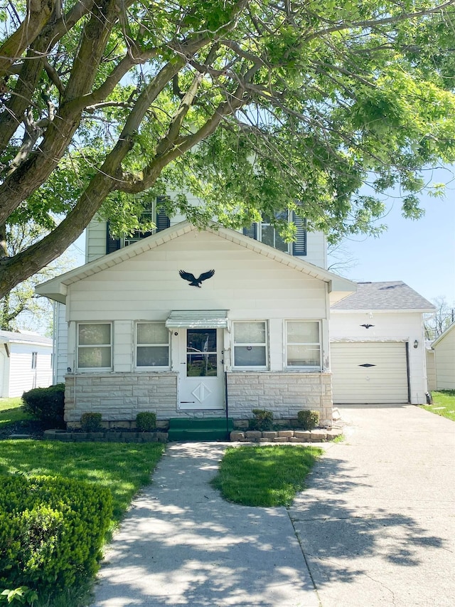 710 N Union St, Union City, IN 47390 - view of front of house with stone siding, driveway, and entry steps
