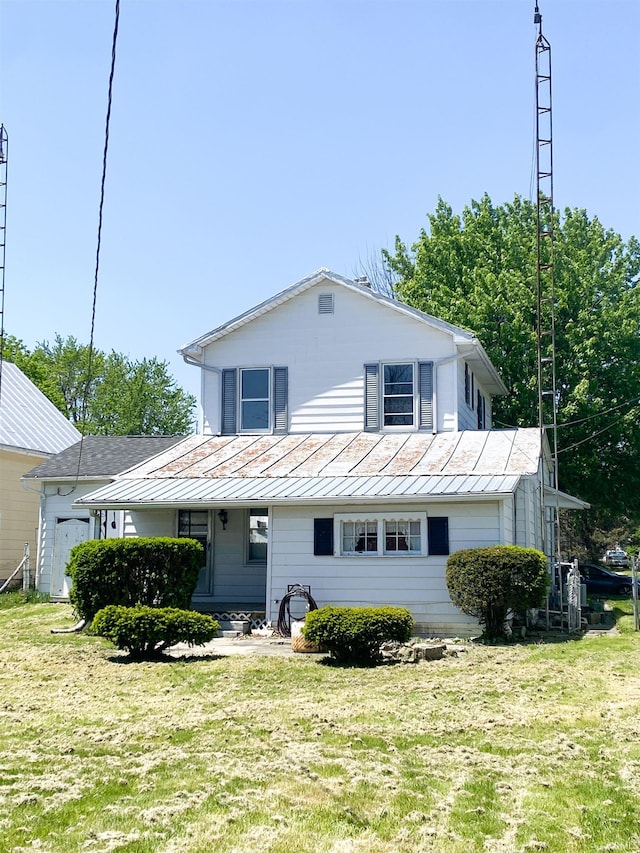 710 N Union St, Union City, IN 47390 - view of front of house featuring a standing seam roof, metal roof, and a front yard