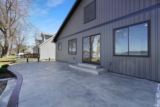 6540 S 070 E, Wolcottville, IN 46795 - rear view of house with a patio and board and batten siding