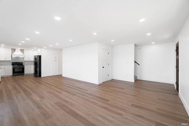 6540 S 070 E, Wolcottville, IN 46795 - basement with freestanding refrigerator, recessed lighting, light wood-style flooring, stairs, and baseboards