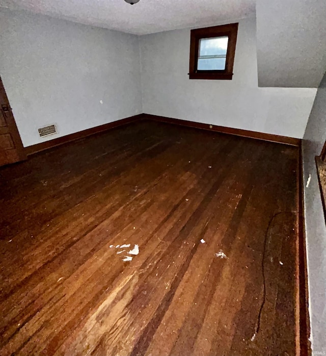 312 Horace Mann Ct, Marion, IN 46952 - spare room featuring wood-type flooring, baseboards, and a textured ceiling