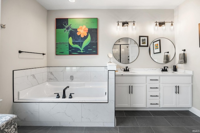 bathroom featuring double vanity, a garden tub, and tile patterned floors