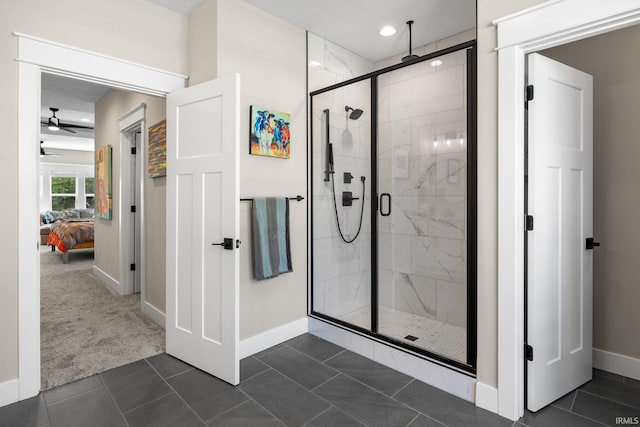 ensuite bathroom featuring baseboards, a shower stall, ceiling fan, and recessed lighting