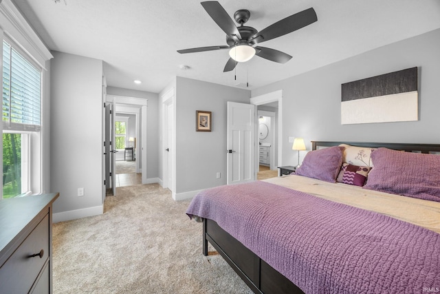 bedroom with baseboards, light carpet, and ceiling fan